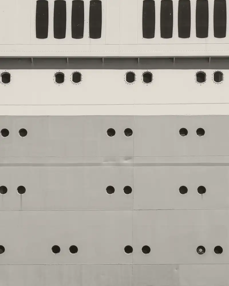 Portholes along the side of a ship's hull.
